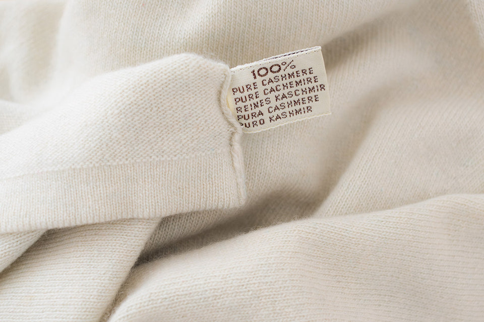 a 100% pure cashmere label on white cashmere fabric