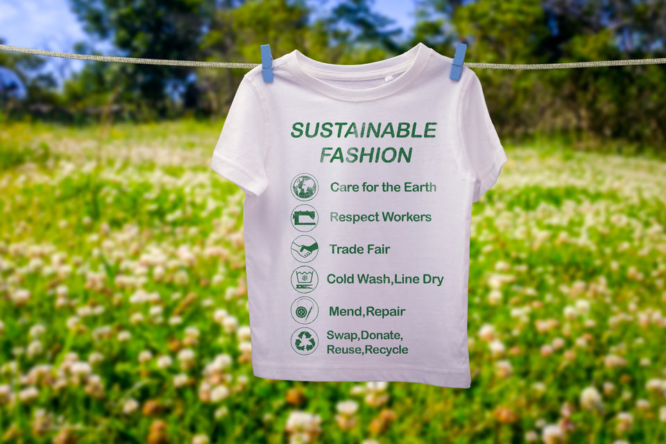 a sustainable message written on a t-shirt hanging on the line