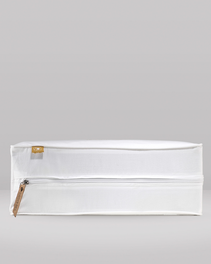 a side view of a large storage bag showing the leather zipper pull and the pip