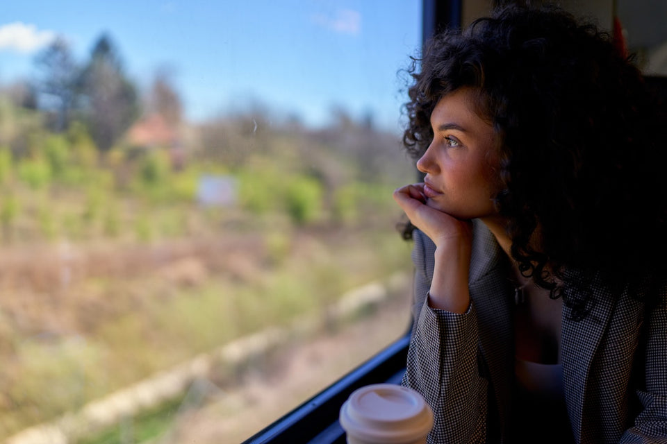 a woman looking out of a train window