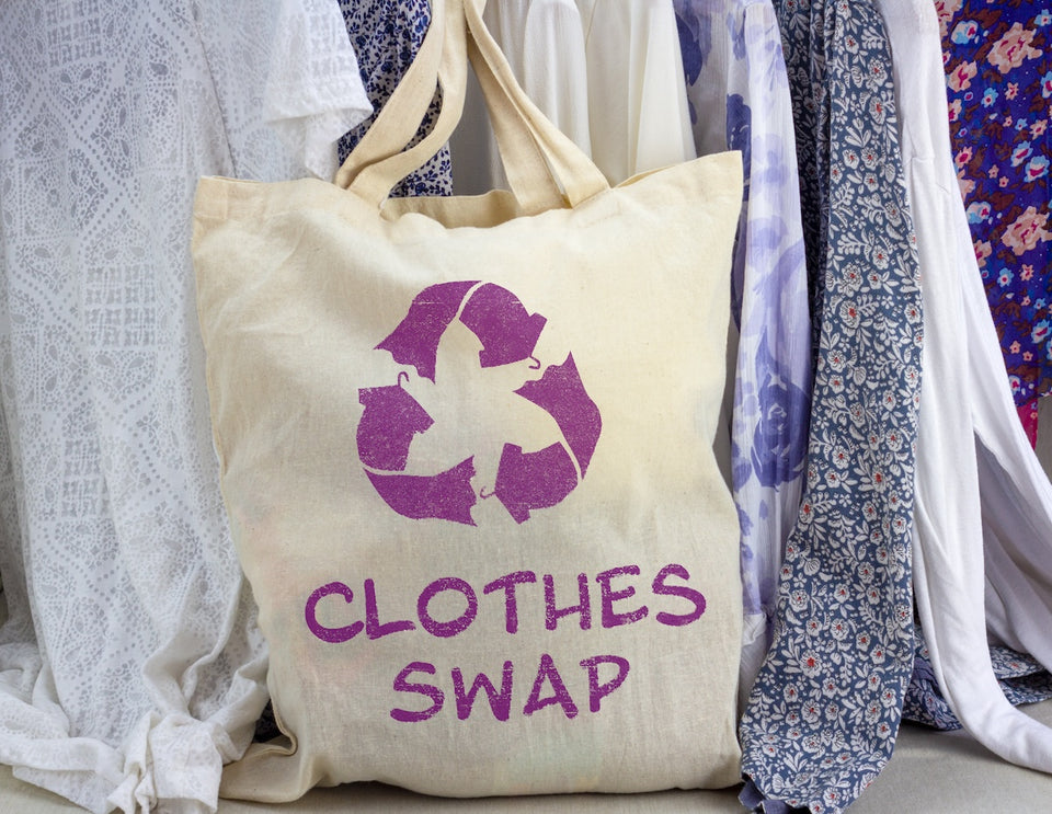 a Clothes Swap fabric bag full of clothing ready to exchange