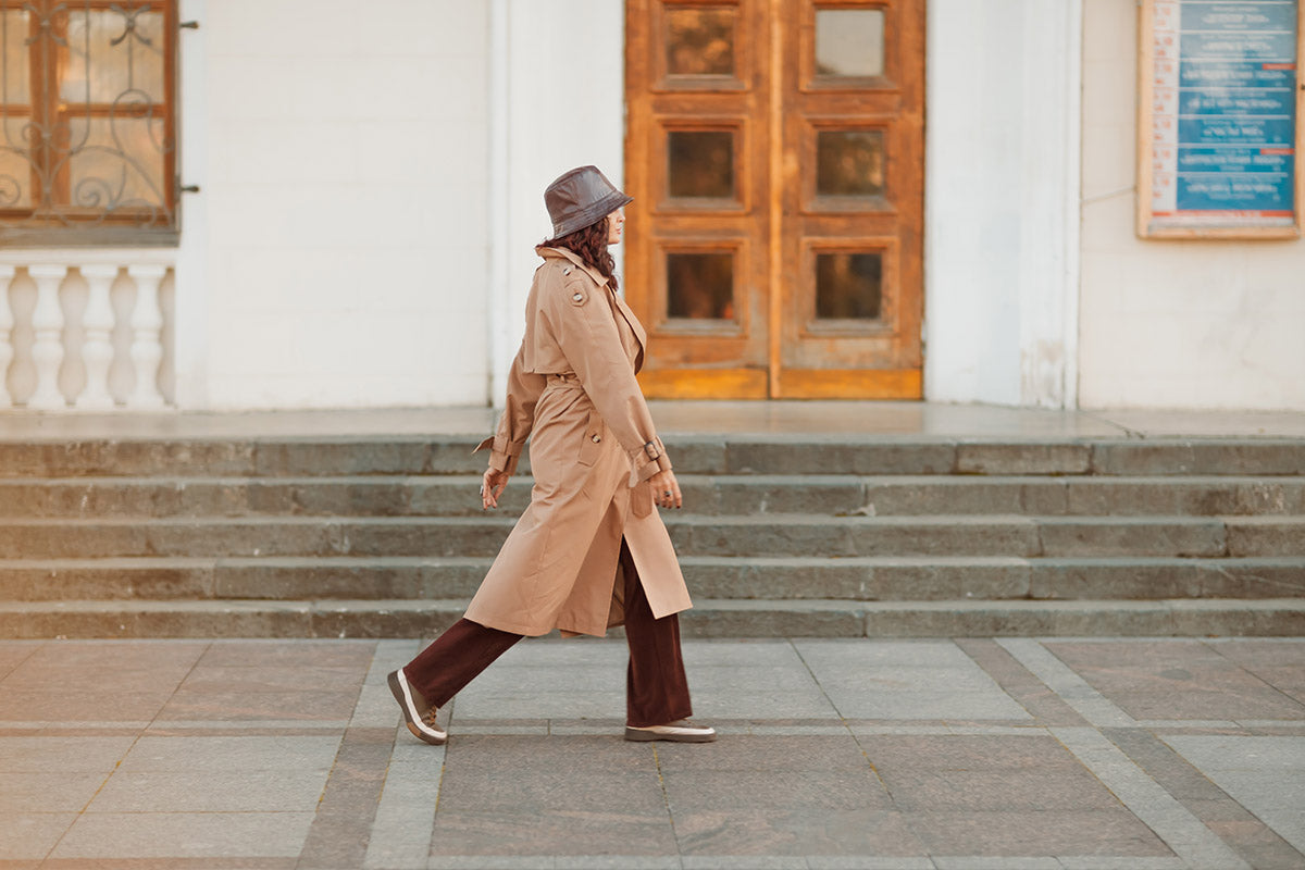 a woman wearing a raincoat and waterproof hat