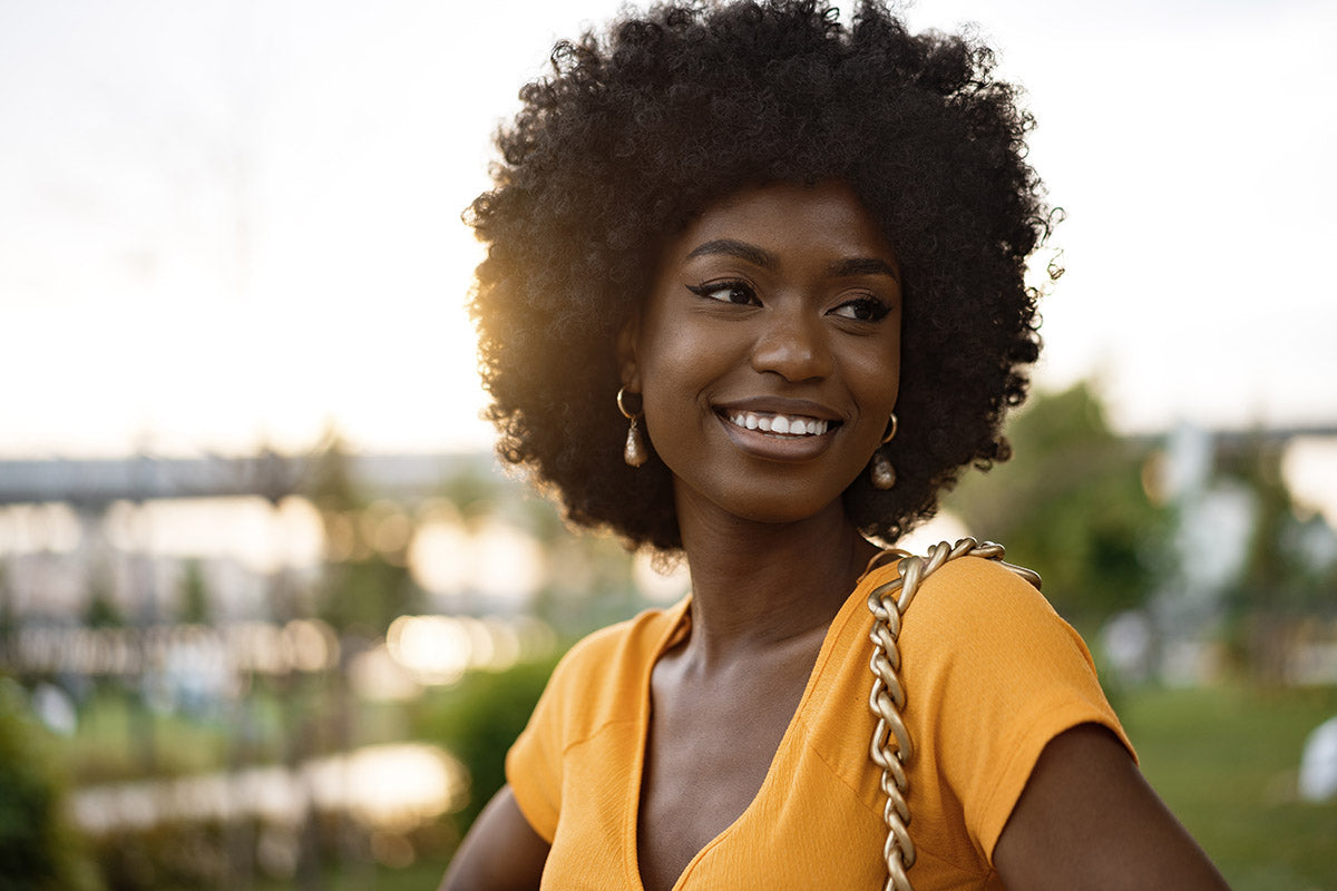 a beautiful chic woman wearing a yellow top