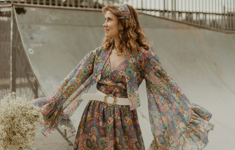 Emily wearing a 70’s style patterned dress (Credit: @jesssamperphoto)