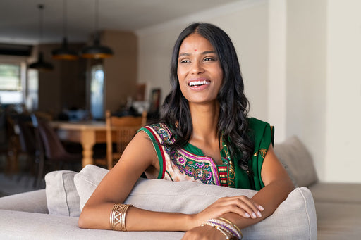 a beautiful woman relaxing at home in traditional clothing