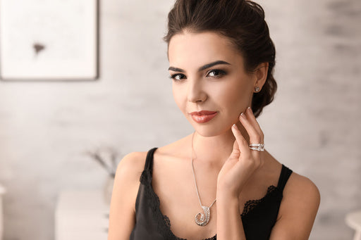 a sophisticated woman wearing beautiful diamond jewellery