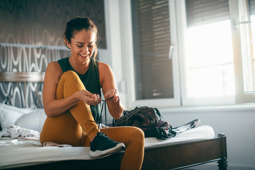 a woman getting prepared for running in her active wear