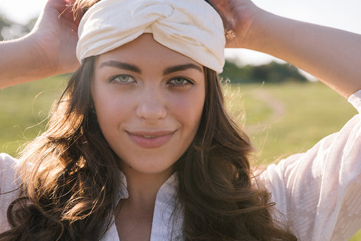 a woman wearing an organic cotton headband