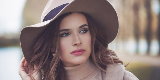 beautiful woman in a cashmere roll neck and felt fedora