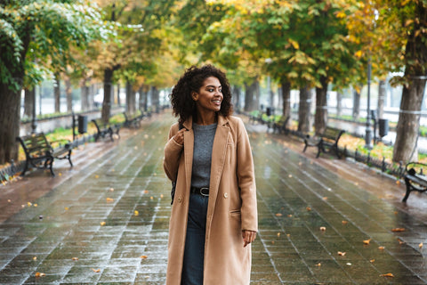beautiful woman wearing a camel wool coat