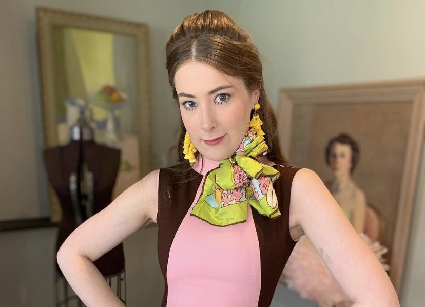 Gabi wears an 1960’s brown and pink wedding dress worn by her great aunt in 1965