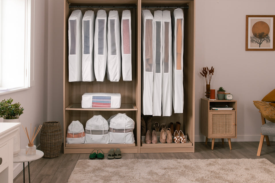 A beautifully organized closet full of breathable Hayden Hill organic cotton Hanging Bags, Storage Bags and Dust Bags