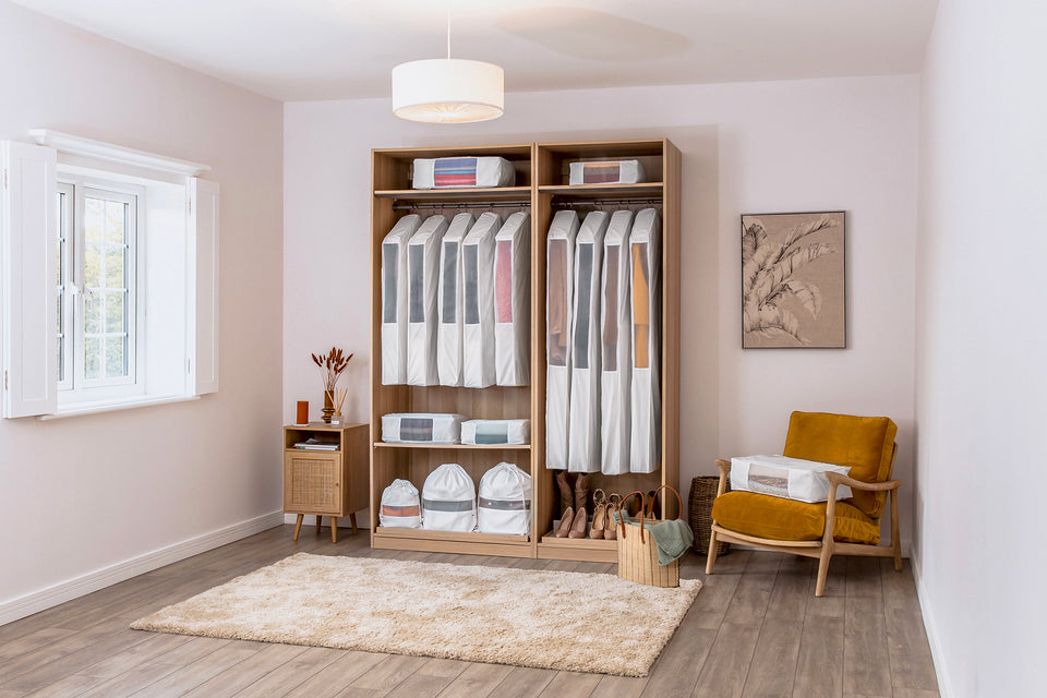 a beautifully organised closet packed full with Hayden Hill garment bags packing cubes and dust bags