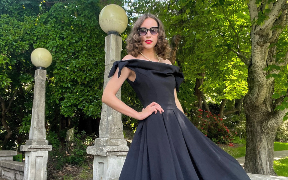 Marley dressing up for an occasion in a black off-the-shoulder dress