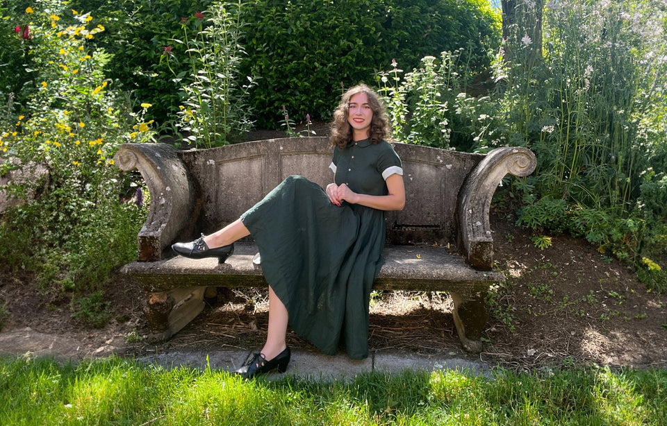 Marley wearing a green short sleeved dress gifted by @sondeflor