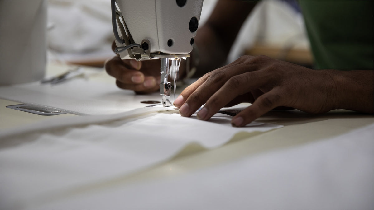 The organic cotton is cut and then stitched into the Hayden Hill clothing storage bags