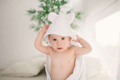 a baby wearing a bamboo towel with fun ears