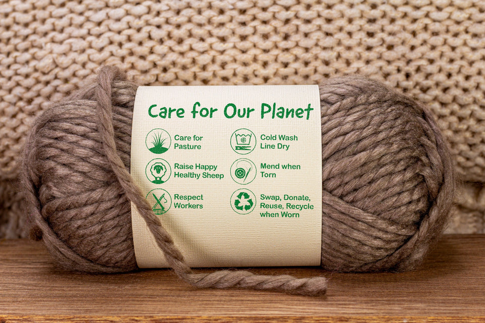 a ball of brown sustainable wool wrapped in a label which reads Care for Our Planet