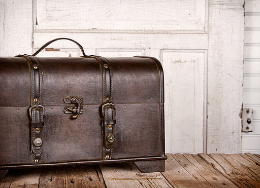 a beautiful vintage wooden trunk with leather straps
