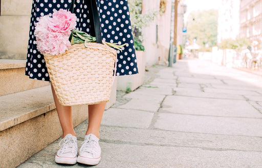
a blue and white spotty skirt teamed with casual white trainers
