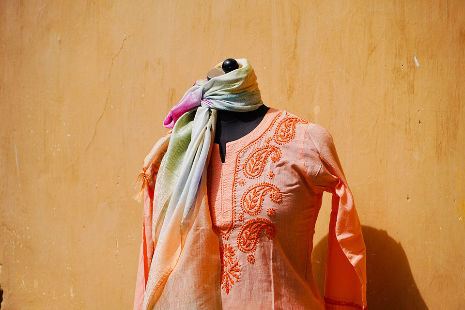 a bright orange embroidered kurta