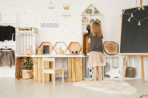 a child in her tidy playroom