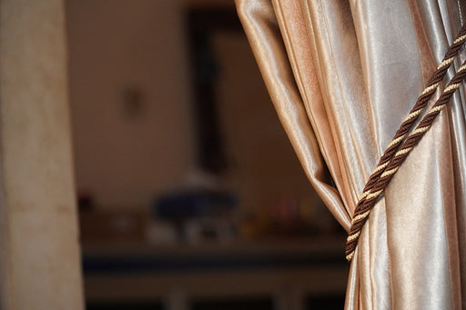 a close up of a curtain made from shiny acetate fabric