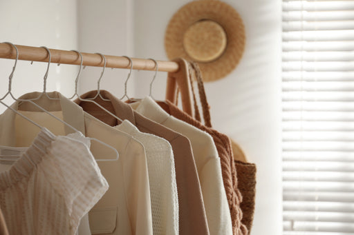 a collection of jackets and tops in cream and tan colours