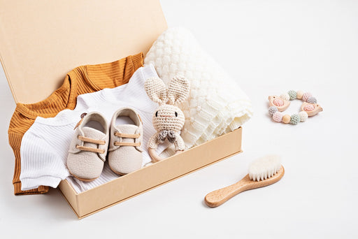 a gift box with organic cotton baby clothes