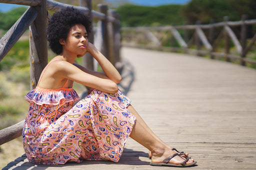 a paisley patterned pink beach dress