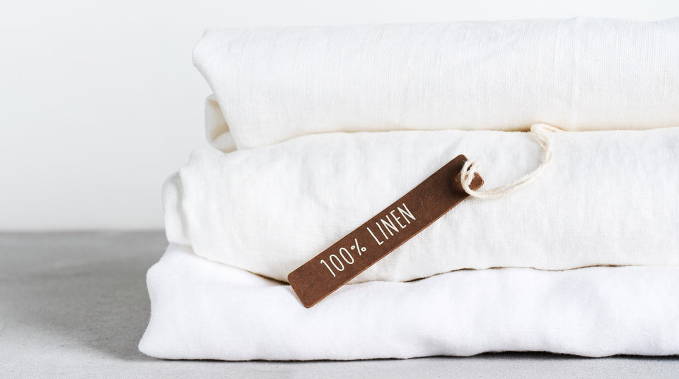 a pile of 100% organic linen