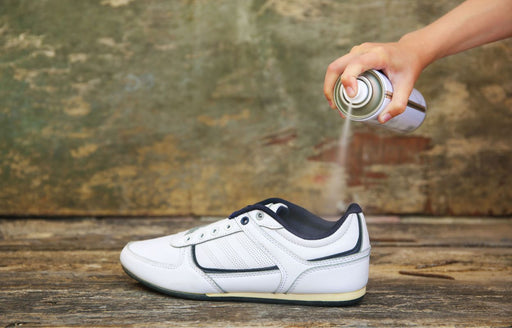 a trainer being treated with a protector spray