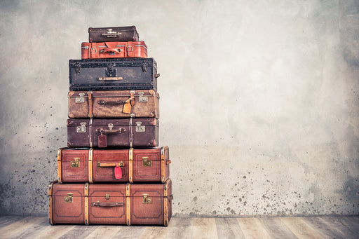 a stack of vintage suitcases