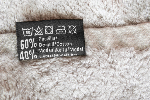 a towel, made of 60% cotton and 40% modal, with a care label