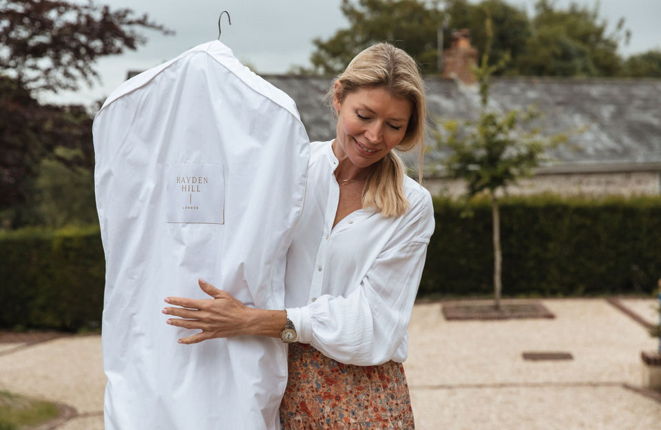 a woman carrying a 100% organic cotton Hayden Hill hanging bag