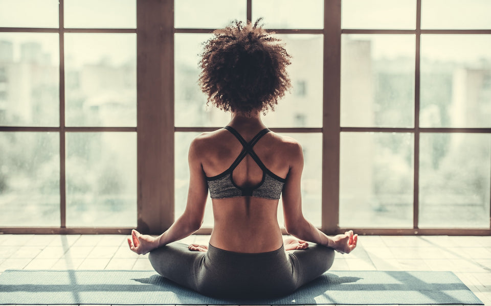 a woman in activewear practising yoga