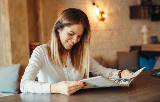 a woman reading a fashion magazine