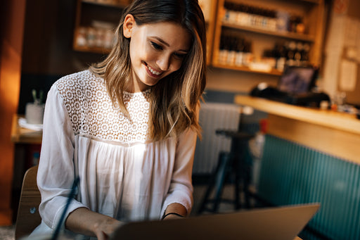 a woman searching the internet on her laptop