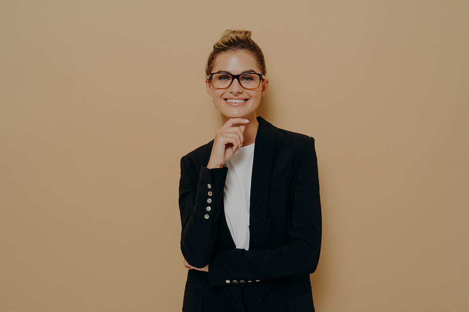 a woman wearing a classic black blazer