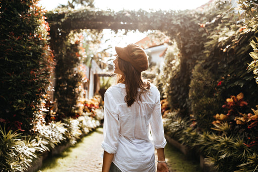 a woman wearing an oversized white shirt