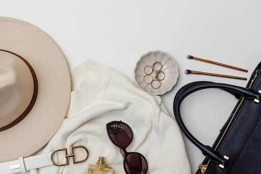 an image of useful accessories including a hat, handbag, sunglasses and jewelry
