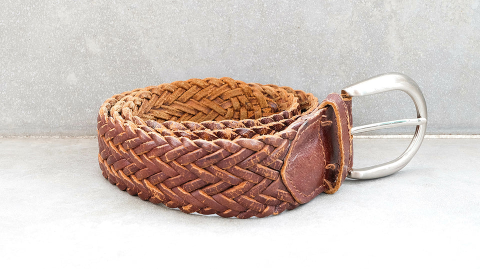 an interwoven brown leather belt