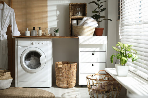 an organised laundry area with wicker hampers