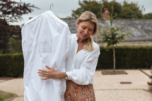 beautiful woman carrying a 100% organic cotton Hayden Hill Garment Bag 