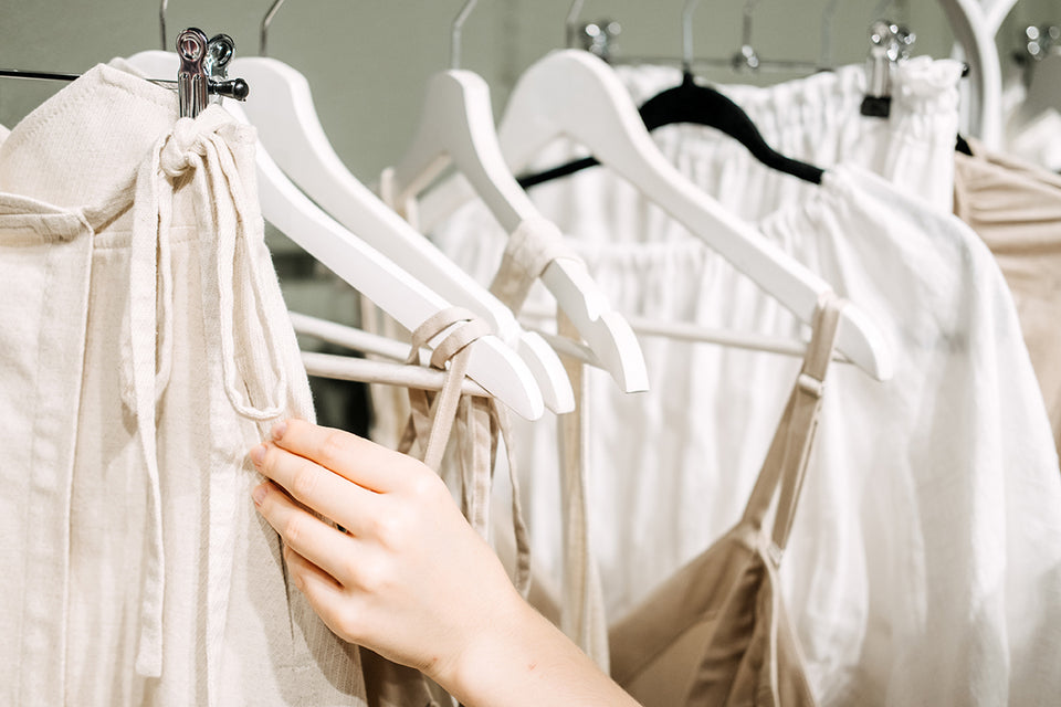 clothing made from organic cotton hanging on a rail