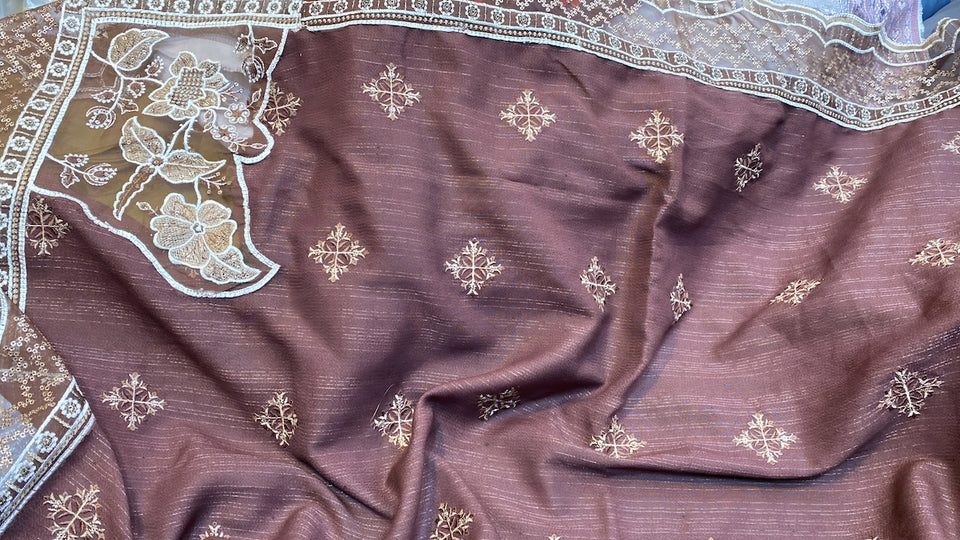 a piece of delicate embroidered dusky pink silk