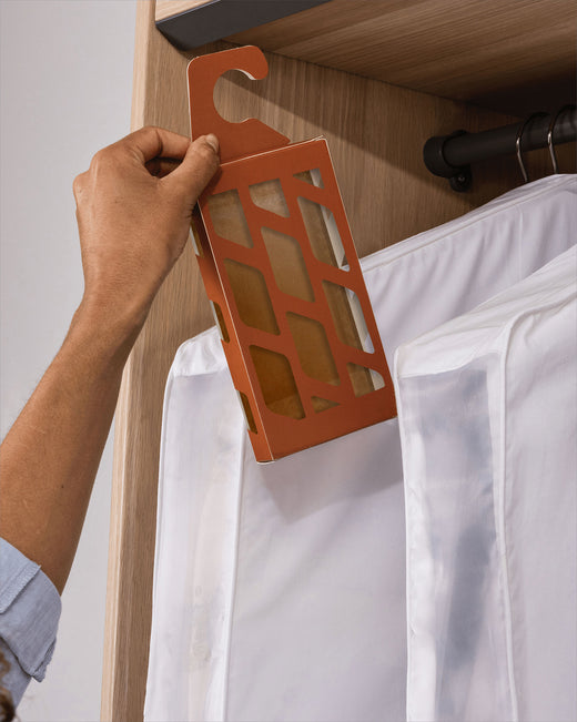 a Hayden Hill Moth Trap being hung in a wardrobe