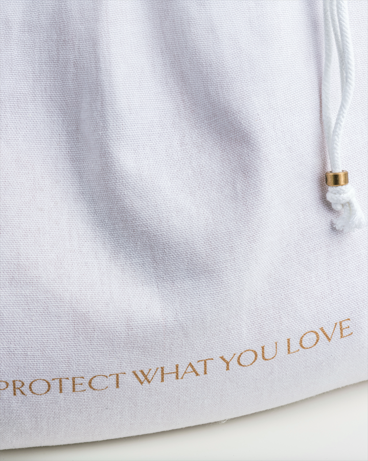 a close up of a Dust Bag with the slogan 'Protect What You Love'