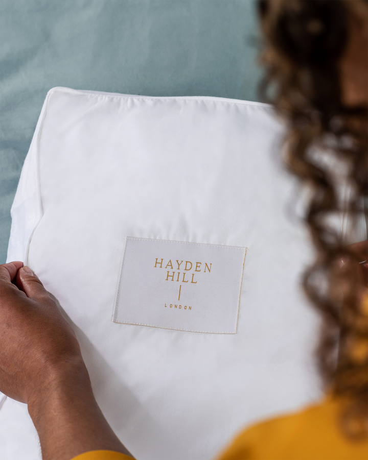 a white Hayden Hill storage bag showing the front label