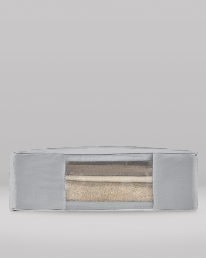 a side profile of a grey extra large storage bag